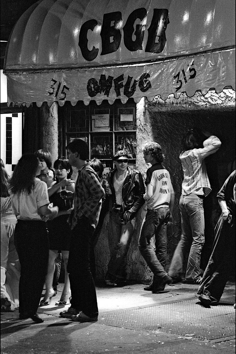Punks hanging out in front of CBGB on the Bowery, NYC, 1977, photographed by Allan Tannenbaum.