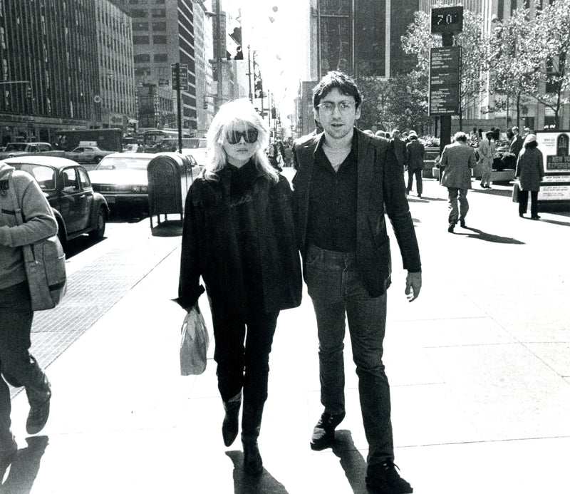 Debbie Harry and Chris Stein walking on Sixth Avenue in New York City, photographed by Godlis, 1978.