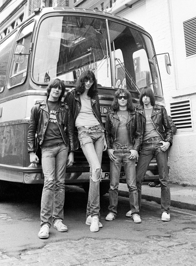 Ramones standing in front of a tour bus, Liverpool, 1977, photographed by Ian Dickson.