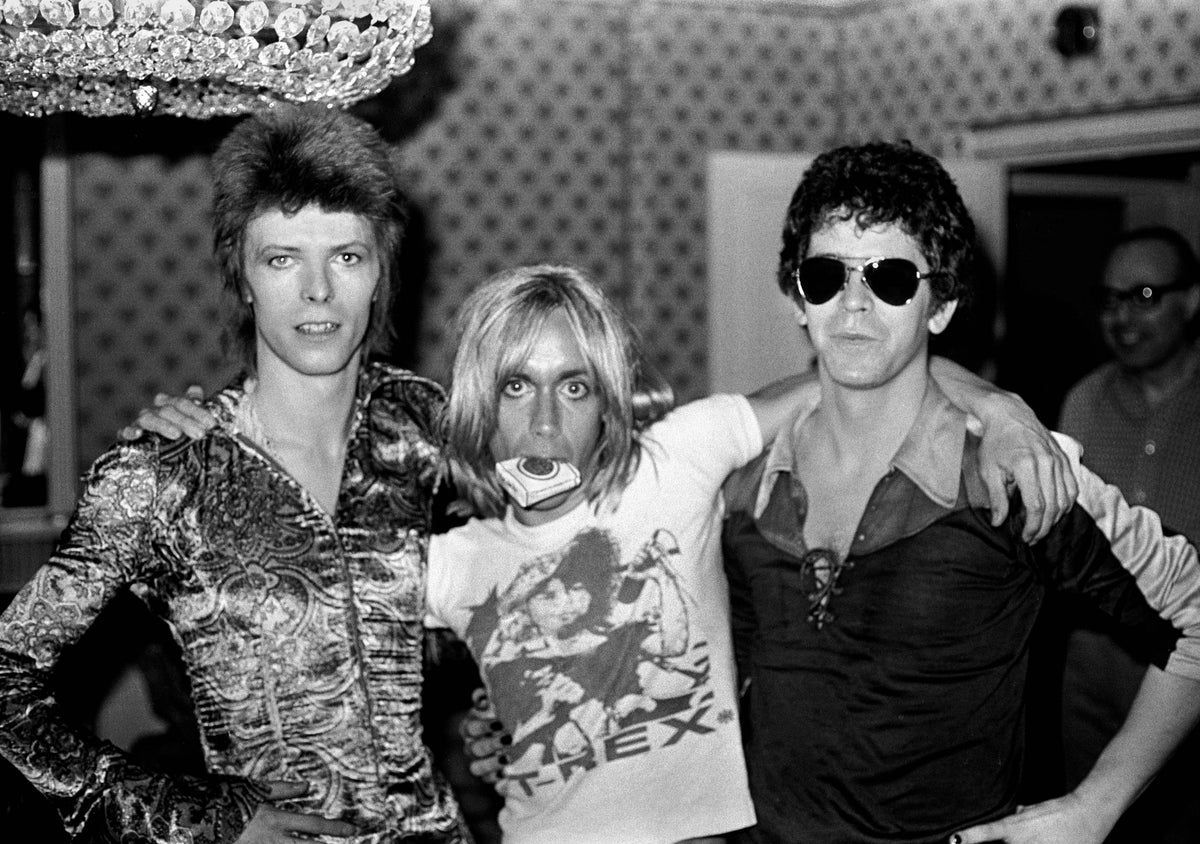 David Bowie, Iggy Pop and Lou Reed photographed in London, 1972 — black and white portrait by Mick Rock.