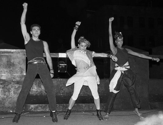 Madonna dancing on a rooftop with two dancers, New York City, 1983, photographed by Bob Gruen.