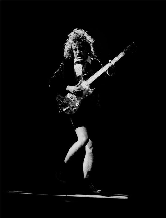 Angus Young Performing Live, 1981, photographed by Patrick Harbron.