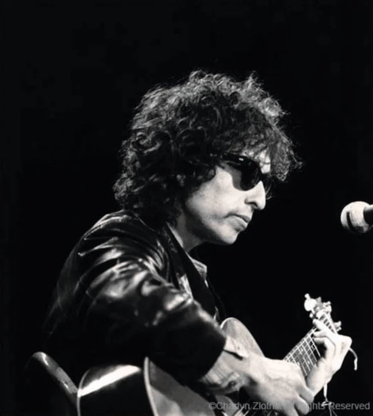 Bob Dylan performing in Austin, Texas, photographed by Charilyn Zlotnik during the Rolling Thunder Revue era, 1976.