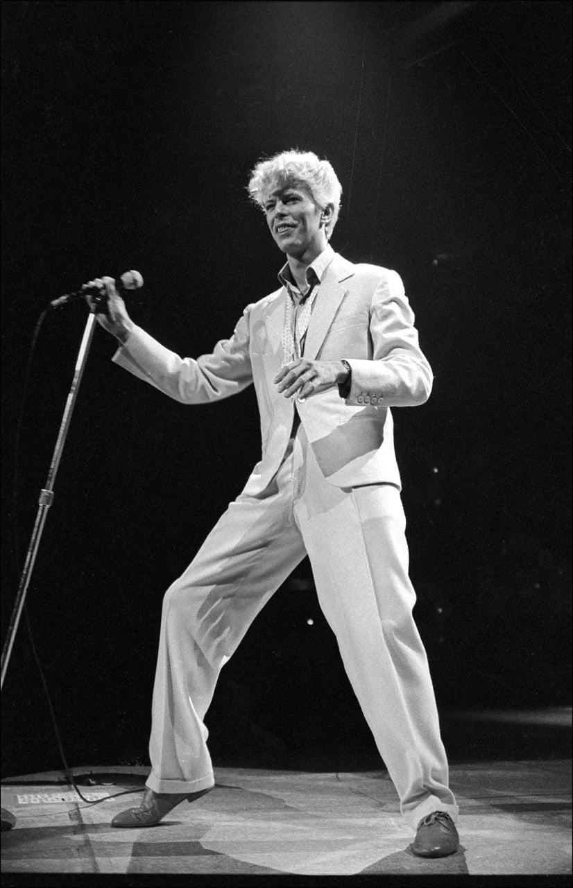 David Bowie performing at Madison Square Garden, New York, 1983. Photograph by Allan Tannenbaum.