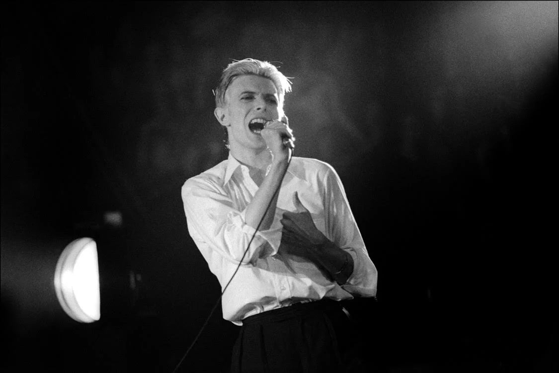 David Bowie performing at Madison Square Garden, New York City, 1976. Photograph by Allan Tannenbaum.