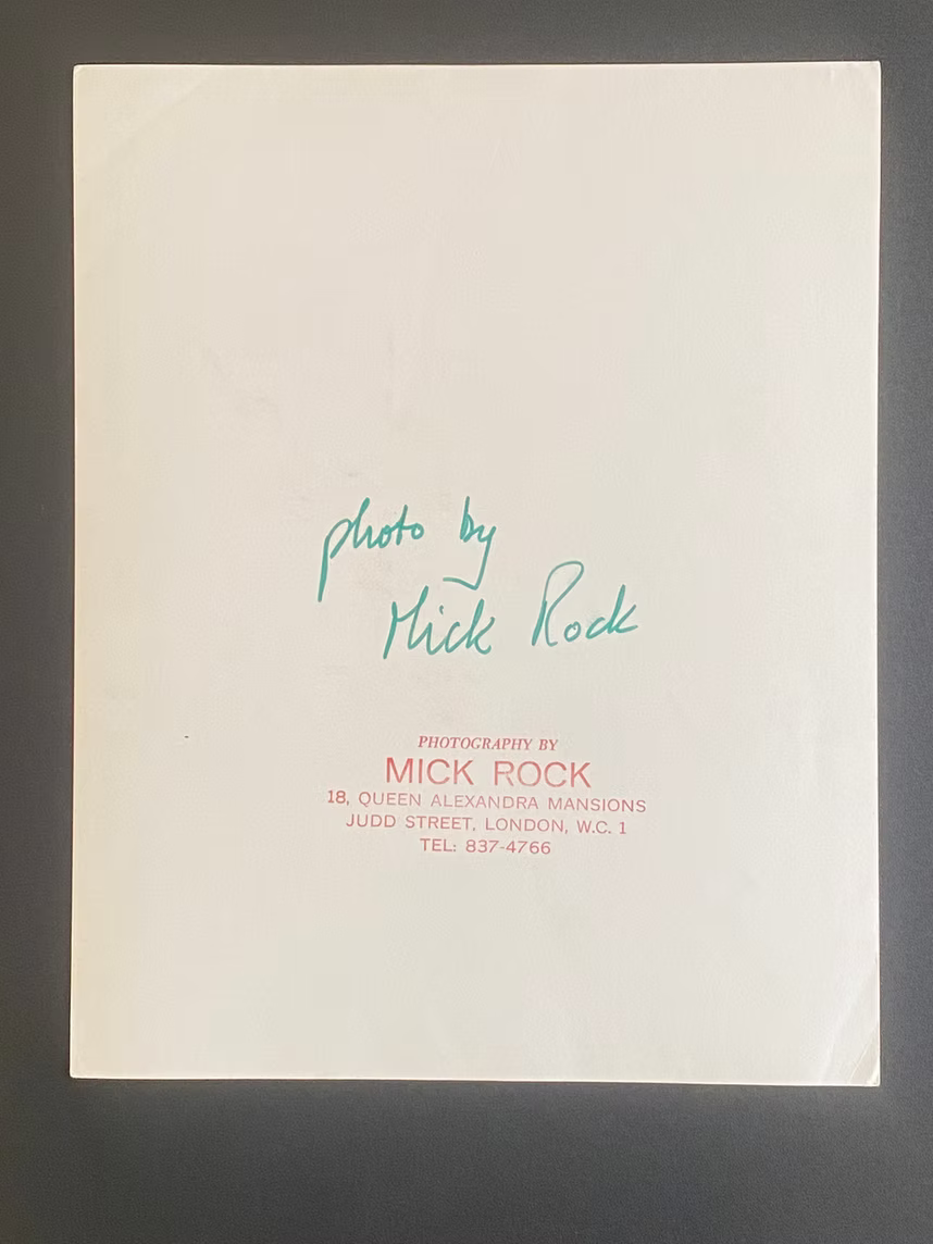 Reverse of the original vintage gelatin silver print, featuring Mick Rock's handwritten inscription and studio stamp, documenting the work's authenticity and provenance.
