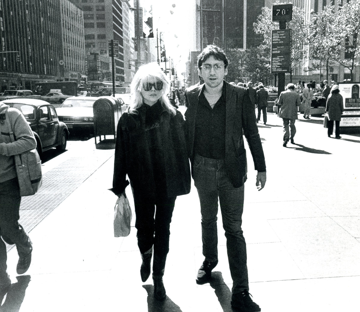 Debbie Harry and Chris Stein walking on Sixth Avenue in New York City, photographed by Godlis, 1978.