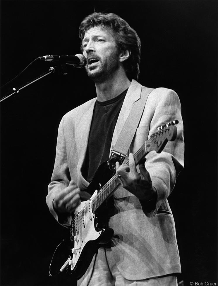 Eric Clapton performing at Madison Square Garden, New York City, 1985, photographed by Bob Gruen.