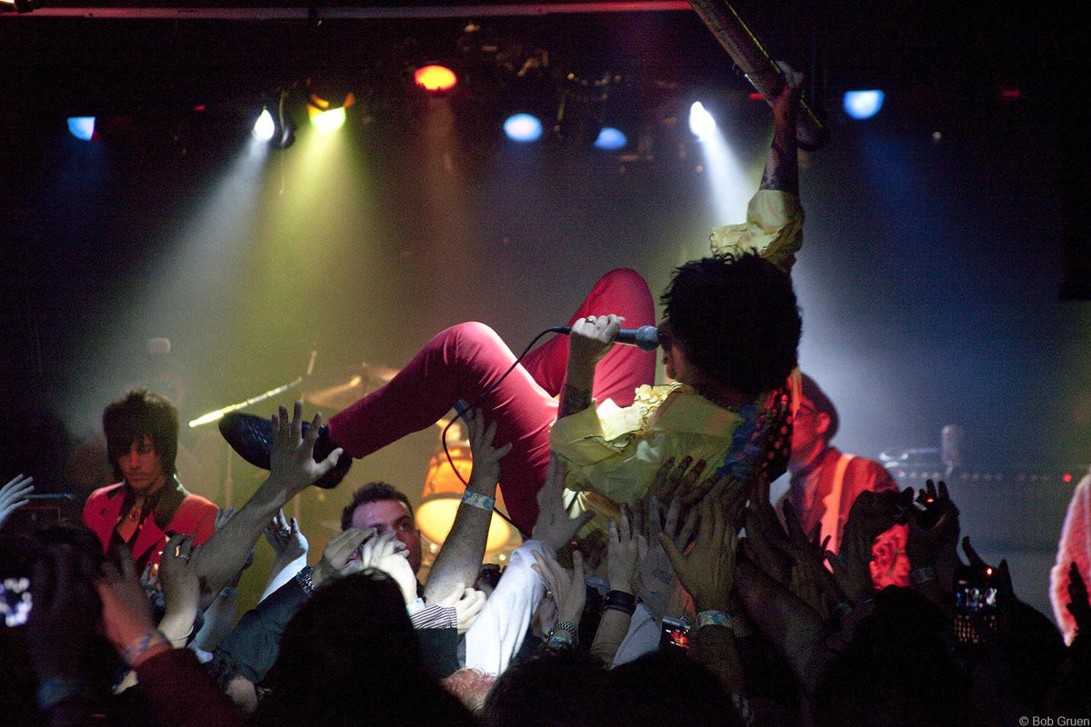 Foxboro Hot Tubs performing on stage in New York City, 2010, photographed by Bob Gruen.