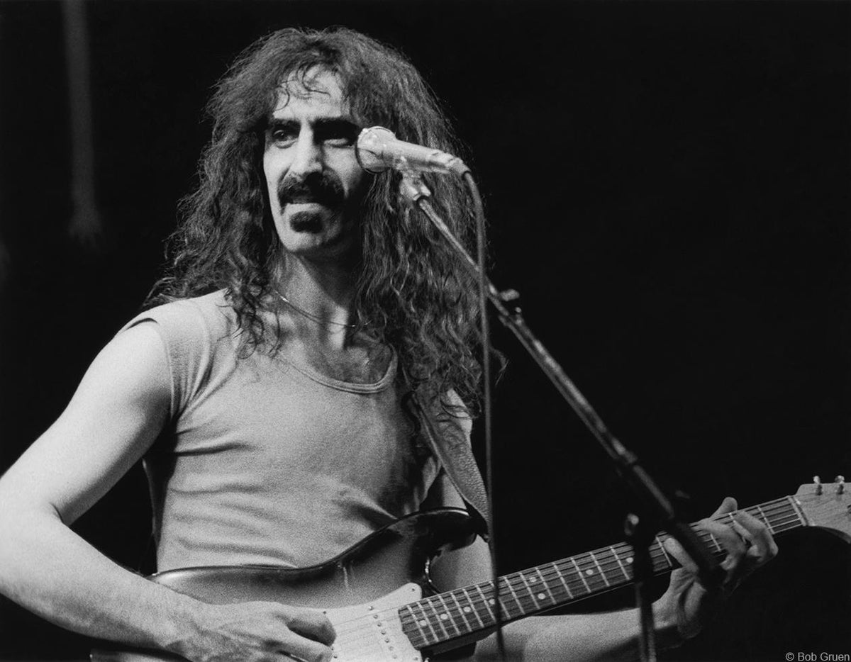 Frank Zappa performing on stage in New York City, 1975, photographed by Bob Gruen.