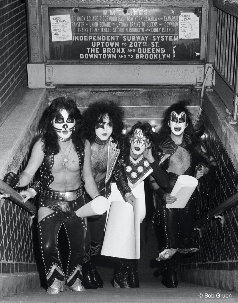 Members of Kiss emerging from a New York City subway station in full makeup, 1974, photographed by Bob Gruen.