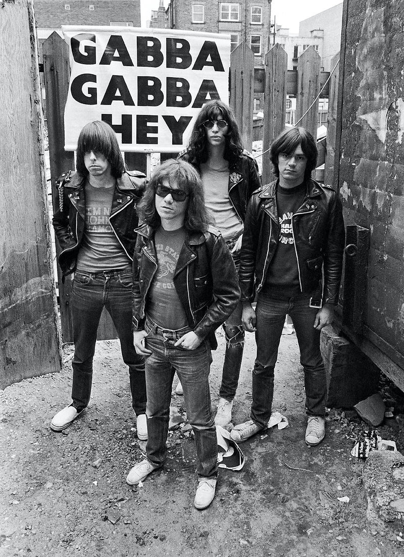 The Ramones in Liverpool, 1977, in front of a “Gabba Gabba Hey” sign, photographed by Ian Dickson.