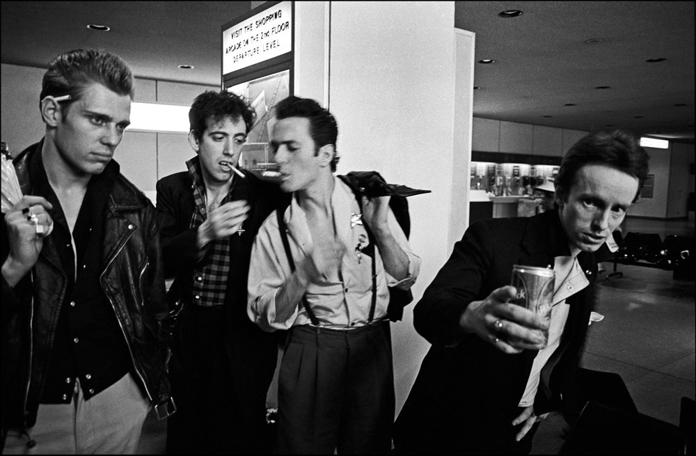 The Clash, JFK Airport, 1981, photographed by Allan Tannenbaum.