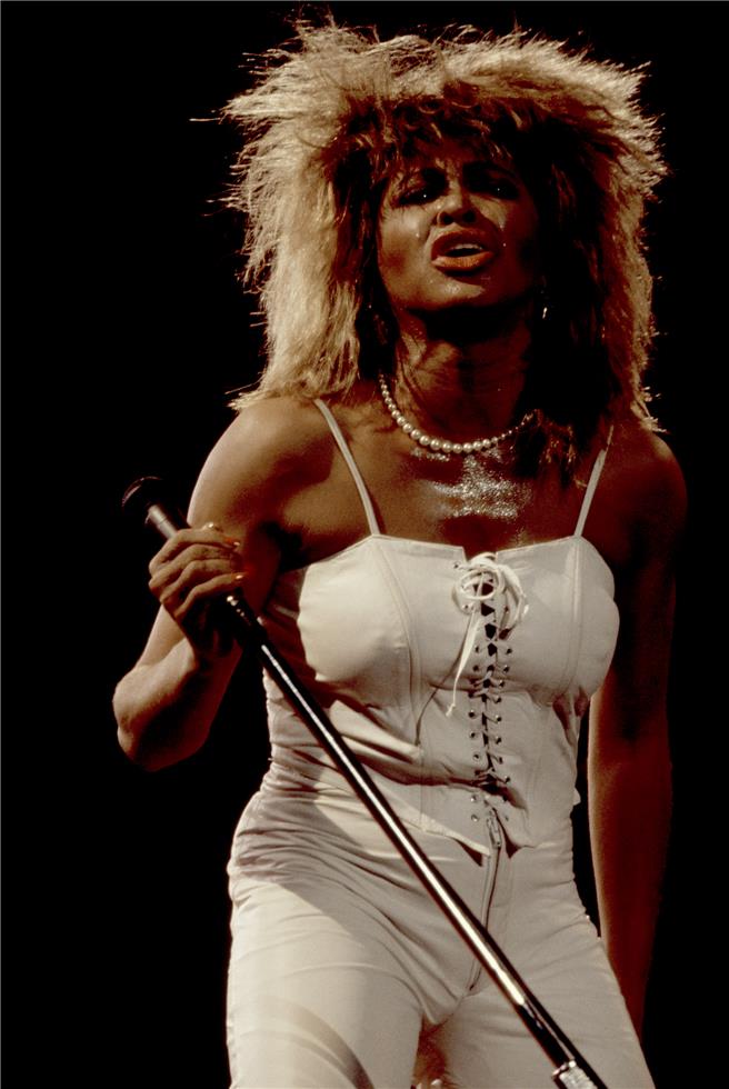 Tina Turner in White Dress, 1984, photographed by Patrick Harbron.
