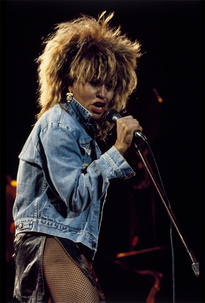 Tina Turner Singing on Stage, 1984, photographed by Patrick Harbron.